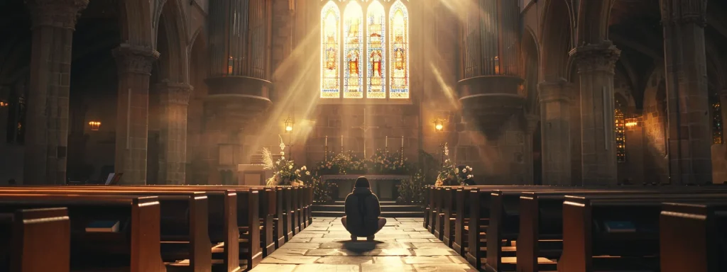 a person kneeling in prayer surrounded by soft, glowing light in a peaceful, dimly lit chapel.